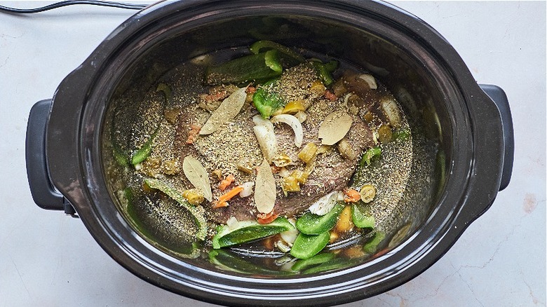 beef and seasonings in crockpot