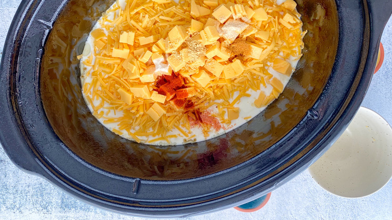 cheese and milk in slow cooker