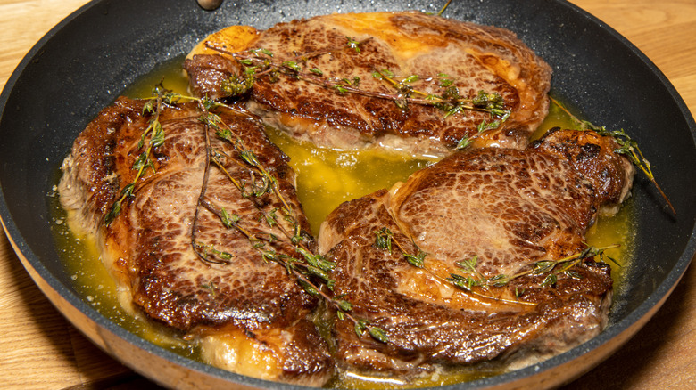 3 steaks in butter with thyme