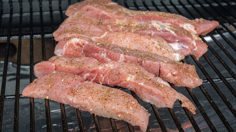 raw pork ribs on grill