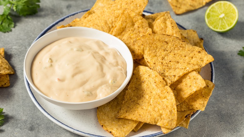 Queso dip and chips on plate