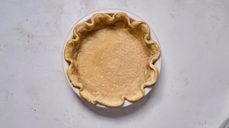 browned pie crust in tin