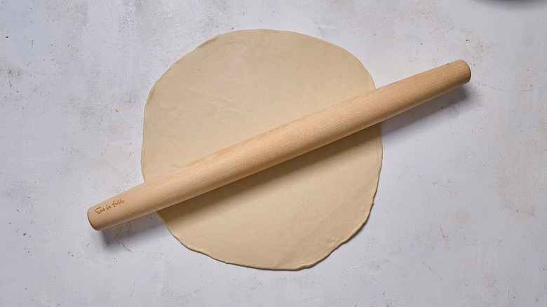 rolling dough on table
