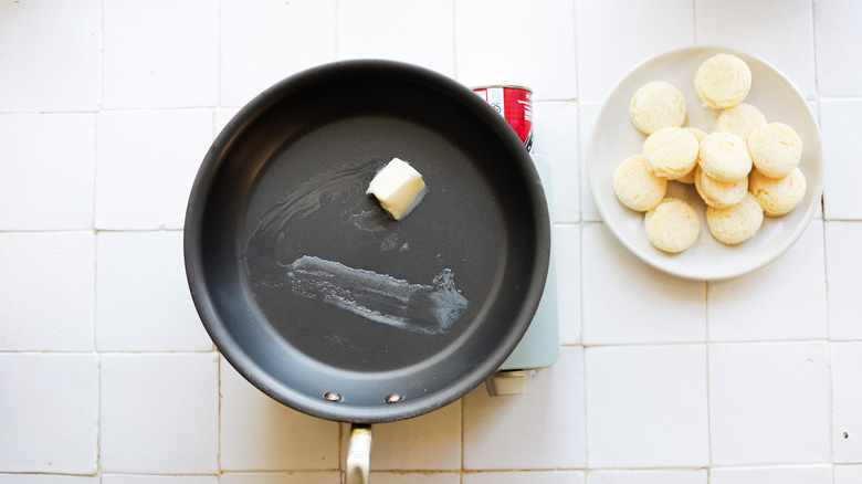 Butter melting in frying pan