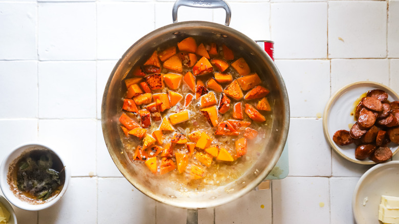 chicken broth simmering in pan