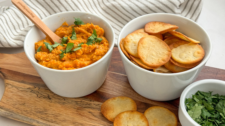 sweet potato dip on board with crackers