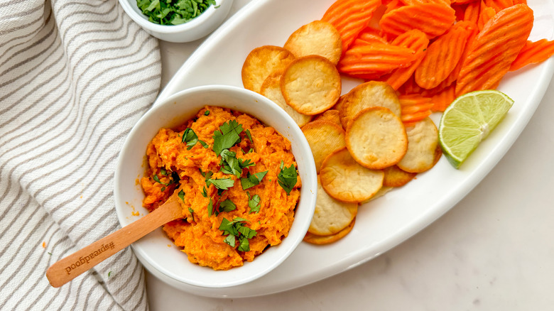 sweet potato dip on platter with pita and carrots