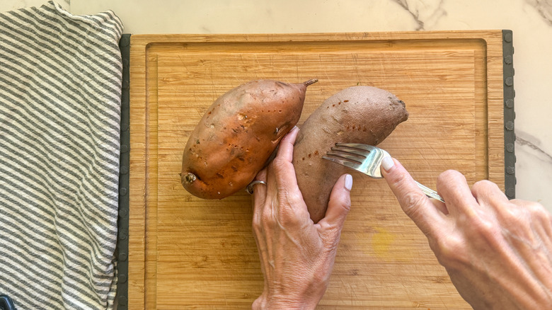 hand poking sweet potato