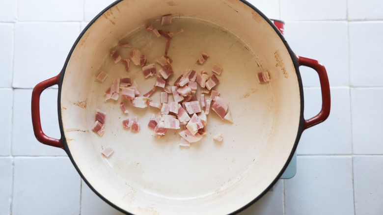 Bacon lardons cooking in pot