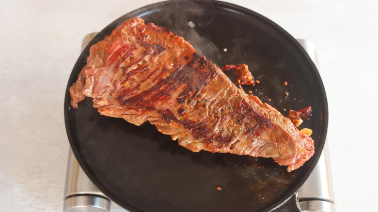 steak cooking on a griddle