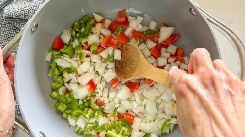 hand stirring pot of ingredients