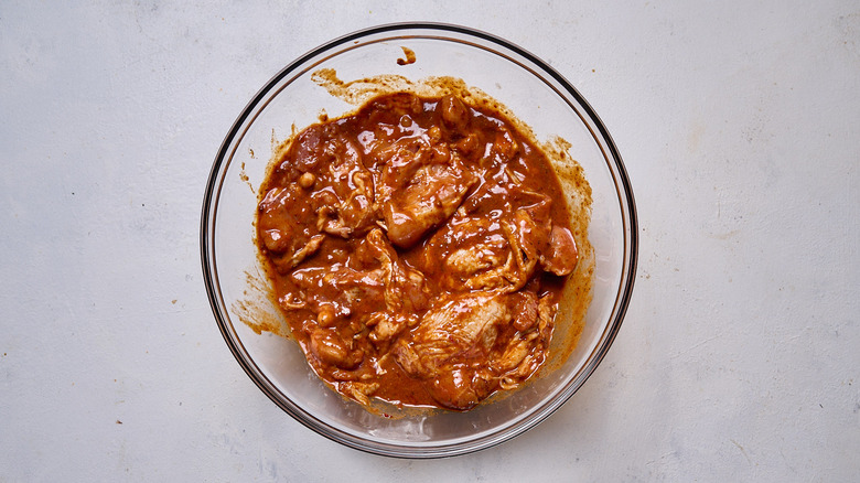 al pastor chicken marinating in bowl