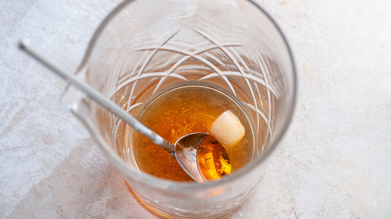 brown cocktail with spoon