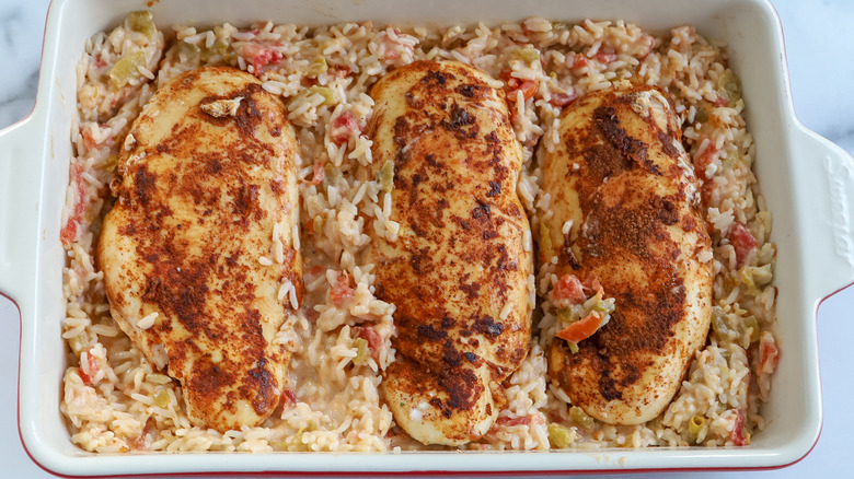 chicken with rice in a casserole dish 