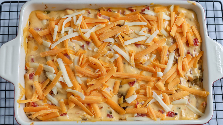 cheese sprinkles over a casserole 