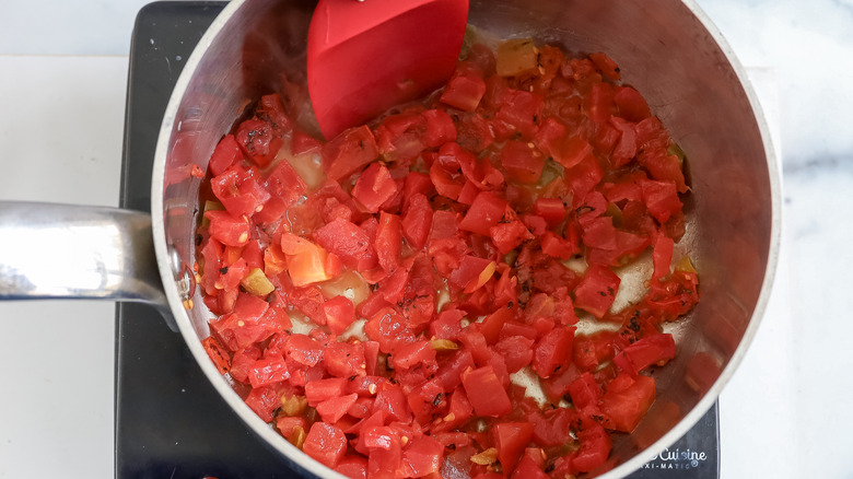 tomatoes and green chiles in a saucepan