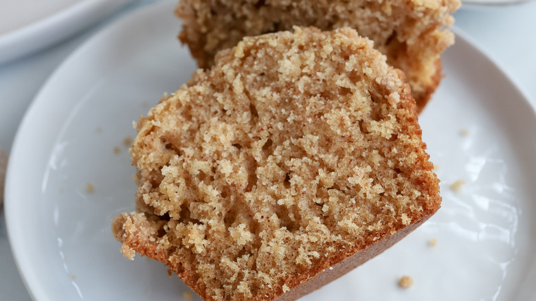 half of snickerdoodle muffin on plate