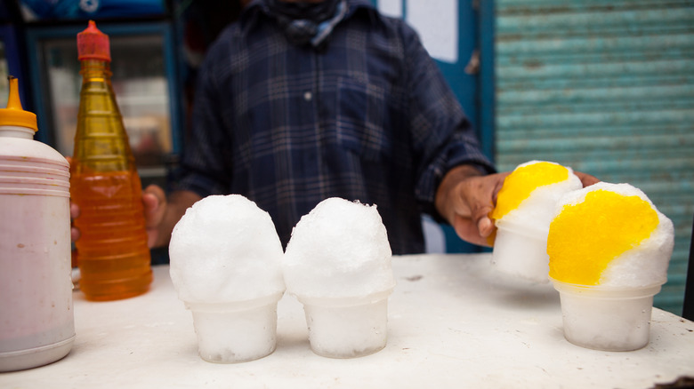 vendor making snowballs