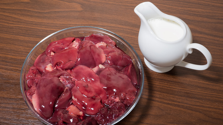 raw chicken liver beside milk jug