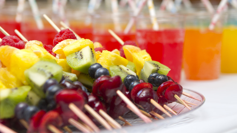 fruit skewers served on plate