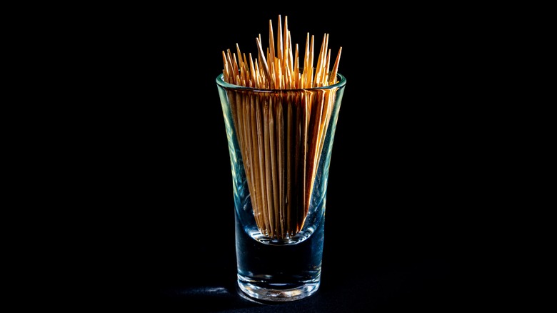 Wooden toothpicks in a shot glass