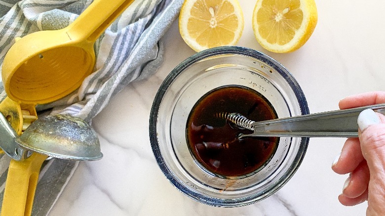 sauce in glass bowl with whisk