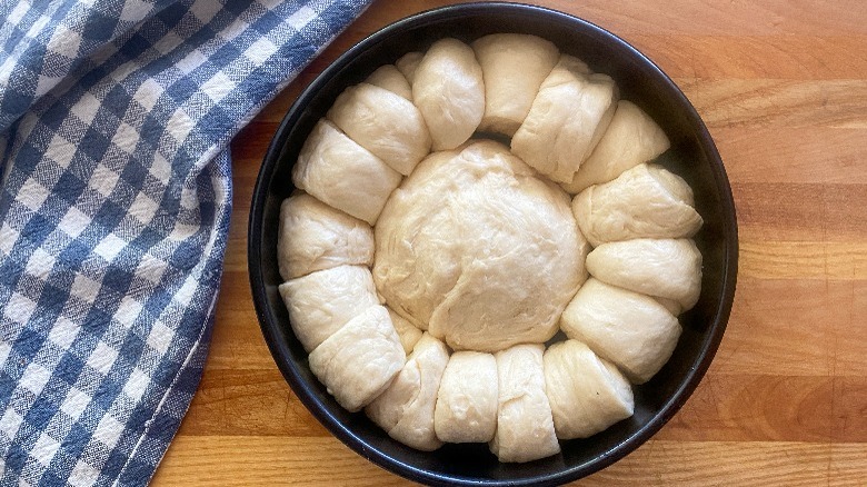 unbaked bread dough in pan