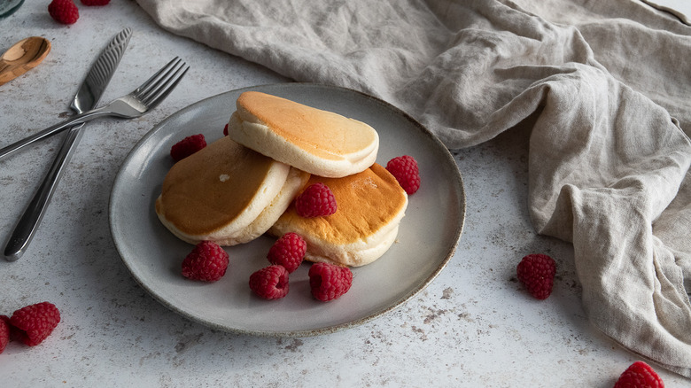 pancakes on plate with raspberries