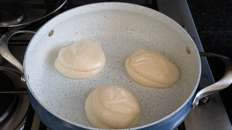 pancakes cooking in pan