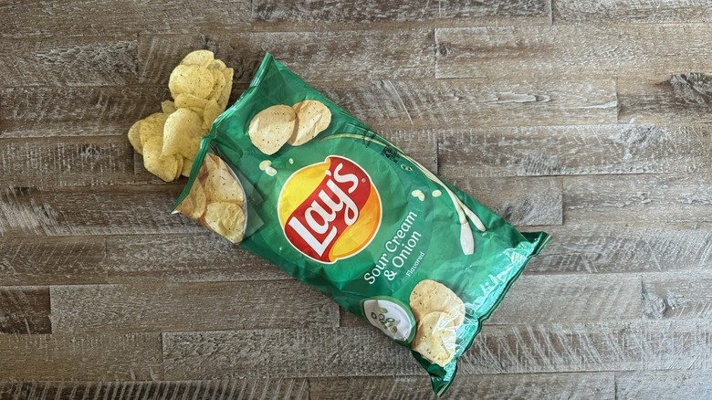 Bag of Lay's potato chips on table