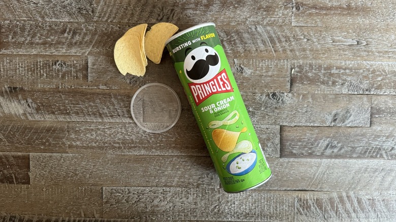 Can of Pringles chips on table