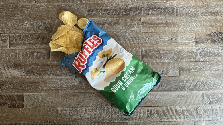 Bag of Ruffles potato chips on table