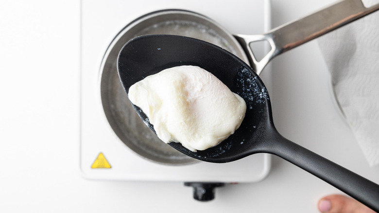 poached egg in spoon