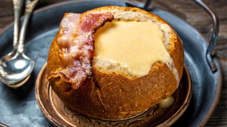 bread bowl with beer cheese soup and bacon