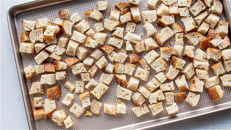 bread cubes on sheet pan