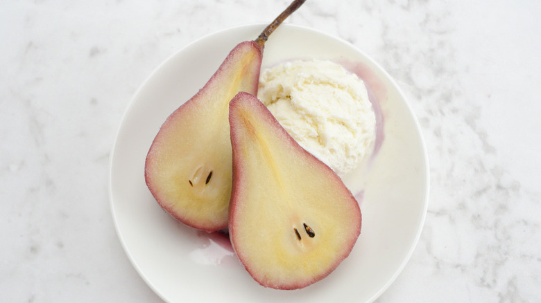 halved pear with ice cream