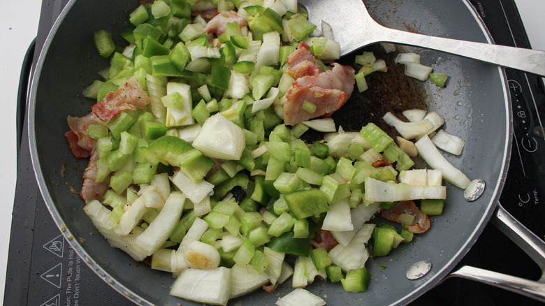 bacon, onion, pepper cooking in skillet