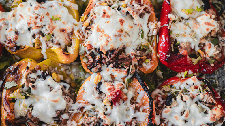 turkey and cheese stuffed peppers on baking sheet