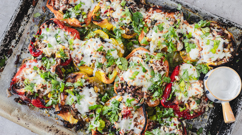 southwest turkey and cheese stuffed peppers on baking sheet