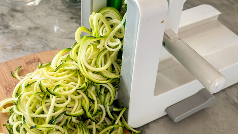 zoodles coming out of spiralizer