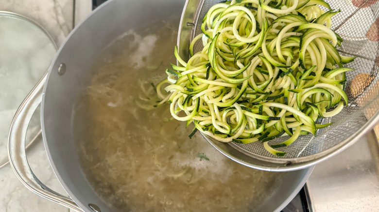 adding zoodles to pot