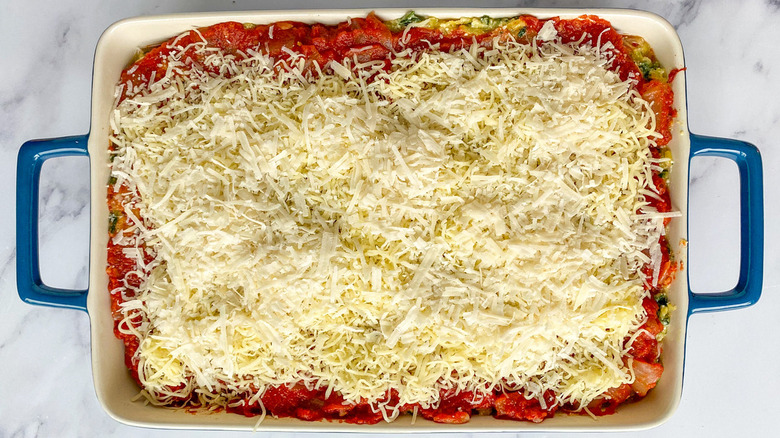 unbaked lasagna in baking dish