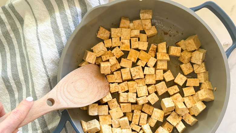 tofu cooking in pan