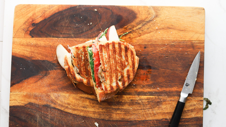 Cut panini sandwich on board