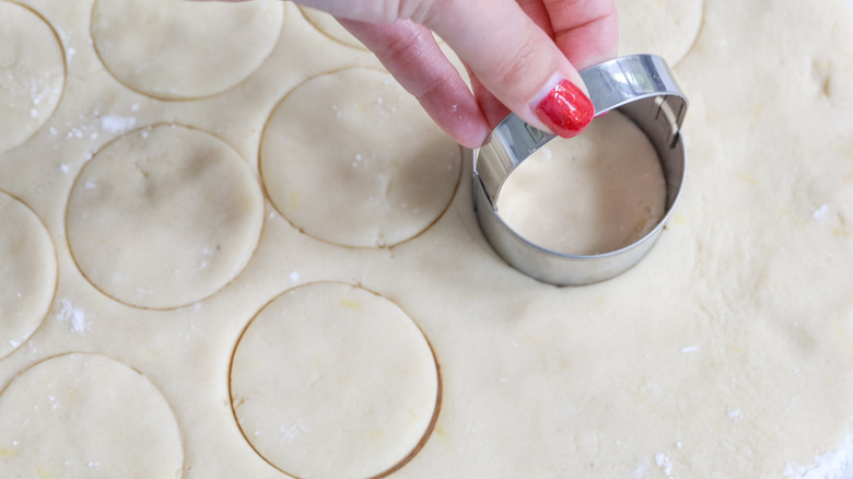 cutting circular cookies with cutter