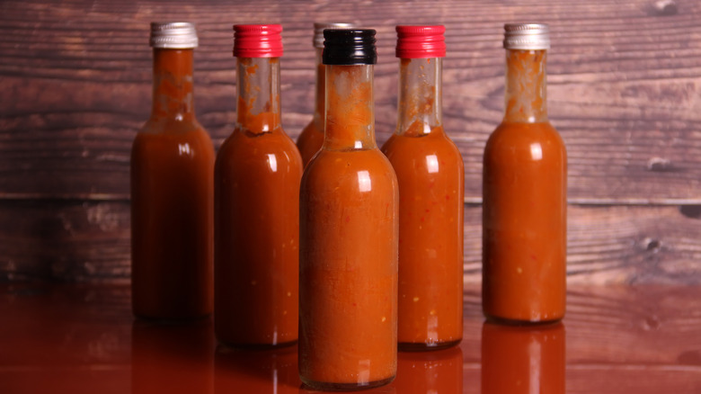 row of hot sauce bottles