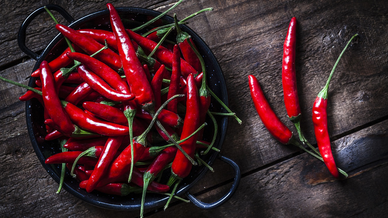 Bowl of chili peppers on table