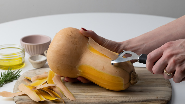 peeling a butternut squash