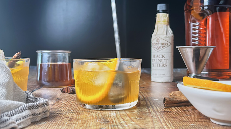 stirring bourbon in glass