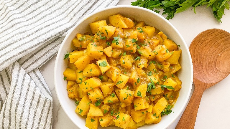 white bowl with aloo curry